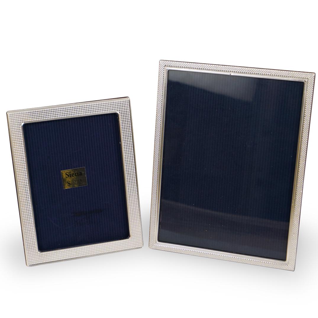 (2 Pc) Siena Sterling Silver Picture Frames: DESCRIPTION:(2 Pc) Two Siena sterling silver picture frames. Includes: (1) One H:8.25" x W:6.5" (Missing glass) Silver frame In box. (2) One H:10.25" x W:7.75" Silver Frame. CIRCA:20th Ct. ORIGIN:Ital