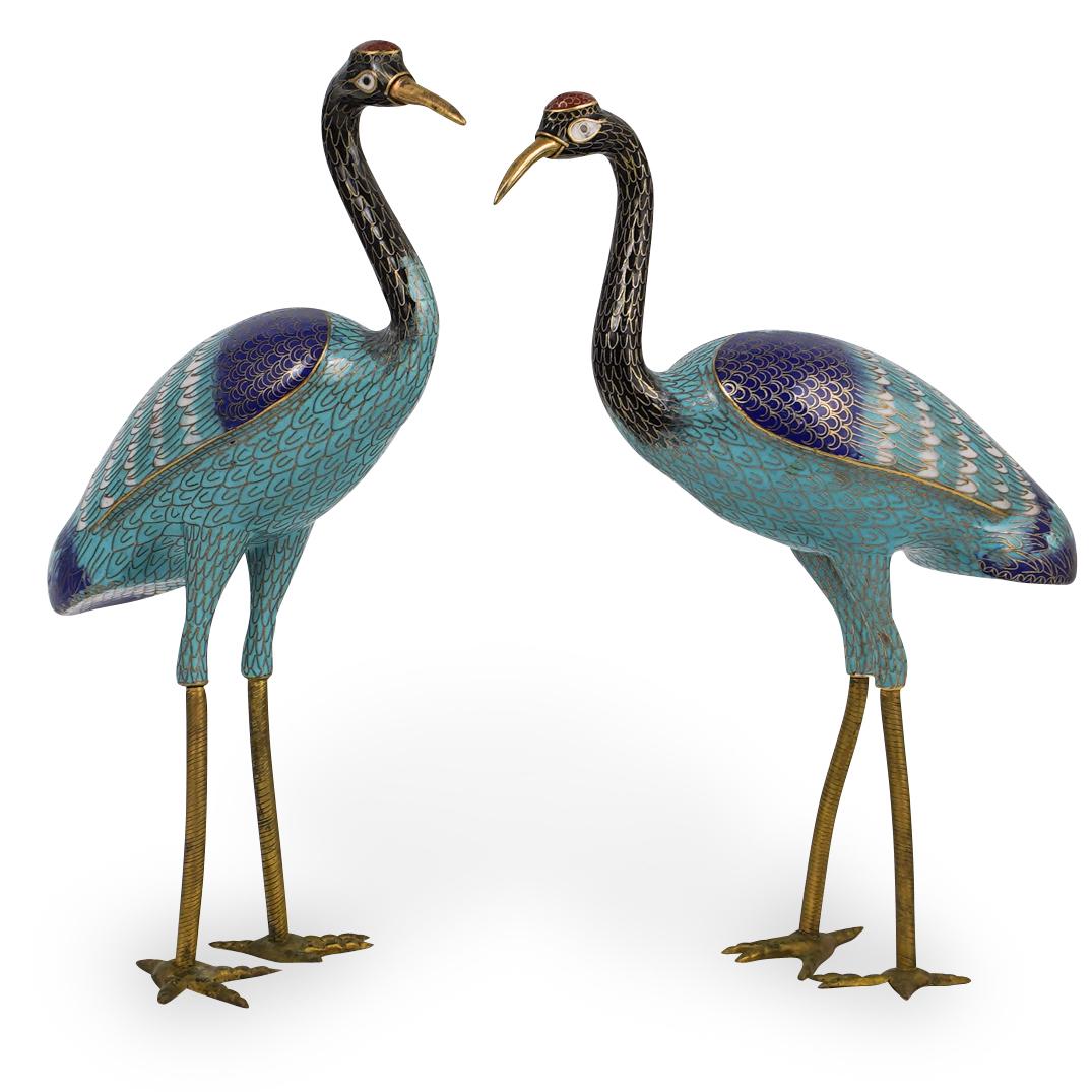 Pair of Chinese Cloisonne Cranes: DESCRIPTION: A pair of Chinese multi colored cloisonne cranes. CIRCA: 20th Ct. ORIGIN:China DIMENSIONS:H:13" x L:10" CONDITION: Great condition. See lot description for details on item condition. More