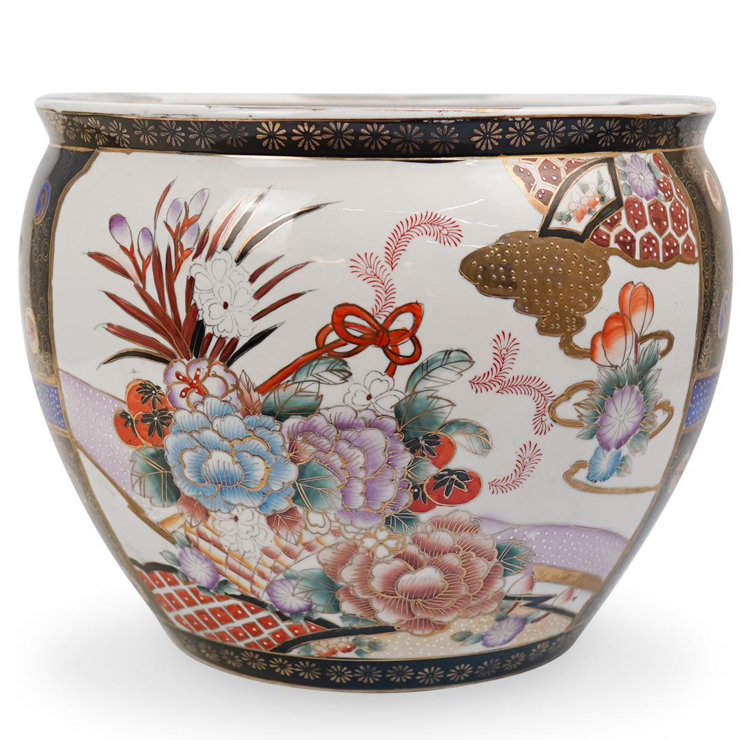 Chinese Porcelain Floral Fishbowl: DESCRIPTION: A large famille noire porcelain fish bowl featuring intricate multi colored floral design bordered by gold lining. Inner bowl has bright orange goldfish motifs. CIRCA: Mid - Late 20th Cen