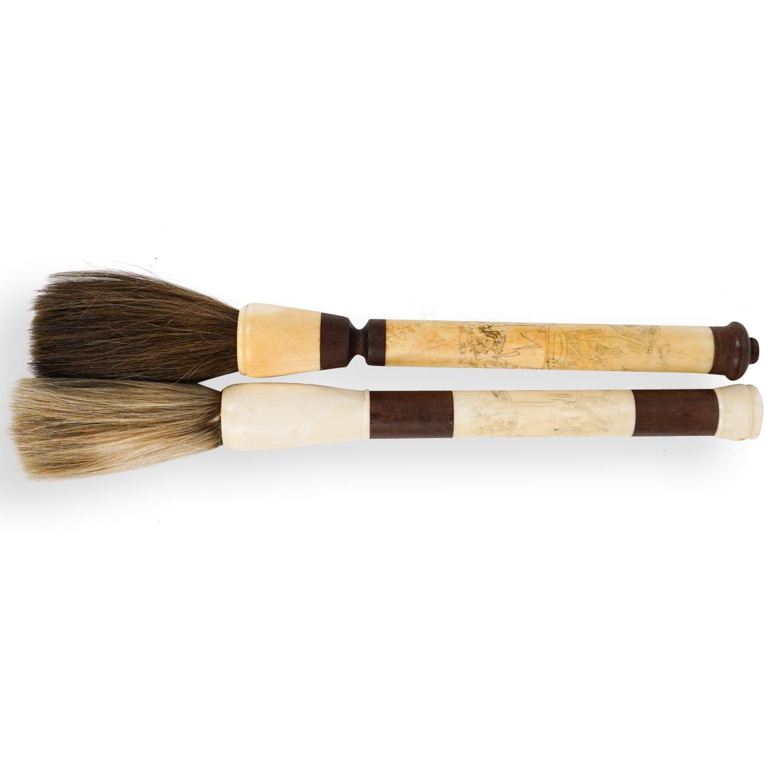 Pair of Japanese Calligraphy Brushes: DESCRIPTION: A pair of Japanese Calligraphy brushes composed of carved wood and bone with village scenes etched motifs.Ã‚ CIRCA: ORIGIN:JapanÃ‚ DIMENSIONS:L:14.5" x W:1.5" & L:14.5 x W:1.25" CON