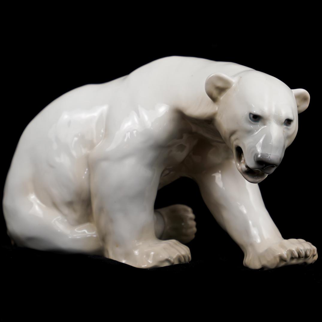 Royal Copenhagen Porcelain Polar Bear: DESCRIPTION: A Royal Copenhagen B&G glazed porcelain polar bear figurine. Marked "B&G, 1857, R, Made In Denmark" CIRCA:20th Ct. ORIGIN: Denmark DIMENSIONS:H:8" x W:7.5" x L:12" CONDITION: Great condit