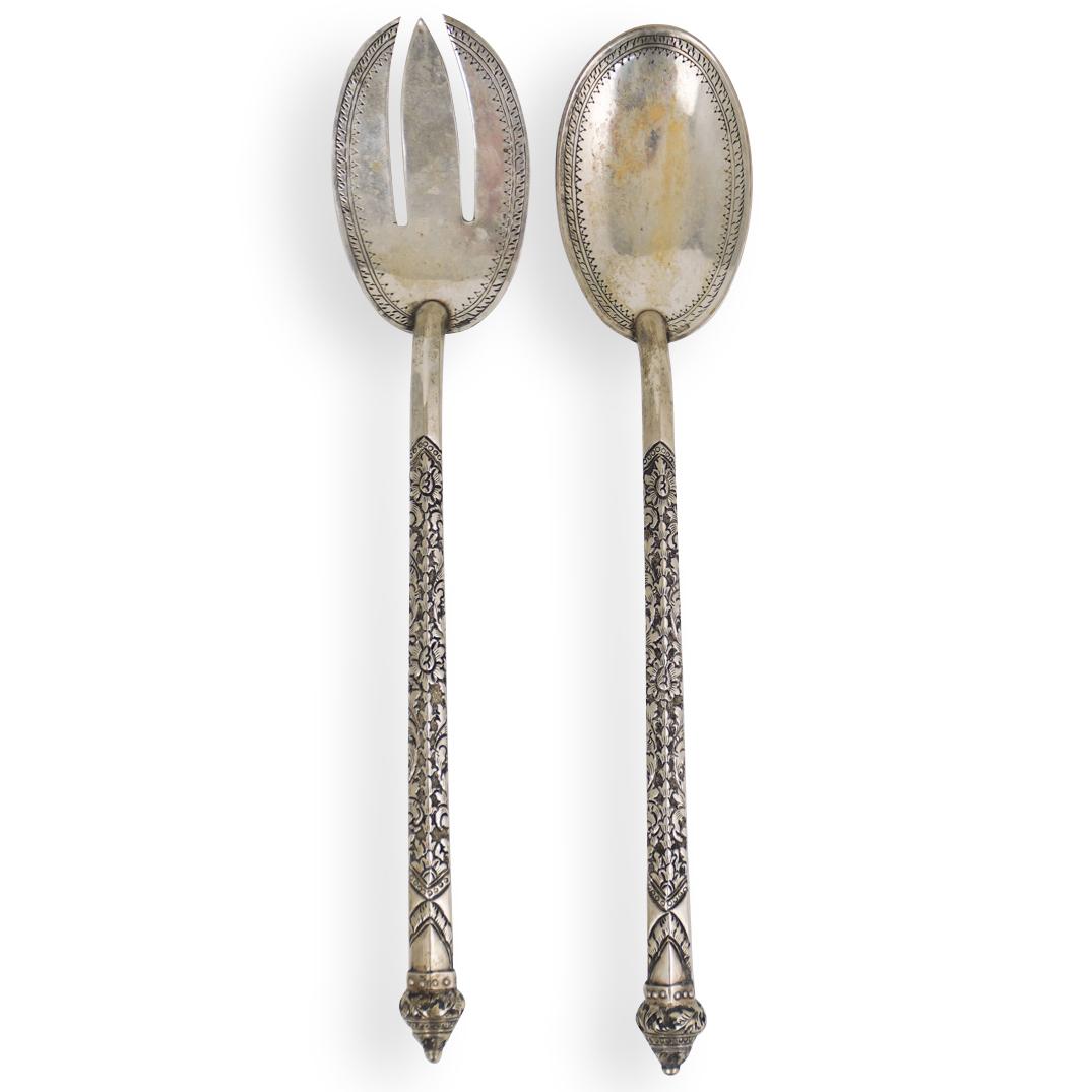 Silver Serving Utensil Set: DESCRIPTION: Silver serving utensil set. Stamped "Daong 850" with hallmark. Total Weight:172 Grams CIRCA:Mid 19th to Early 20th Ct. ORIGIN:Oriental DIMENSIONS: L:11.5" x W:2.25" Total Weight:172 Grams