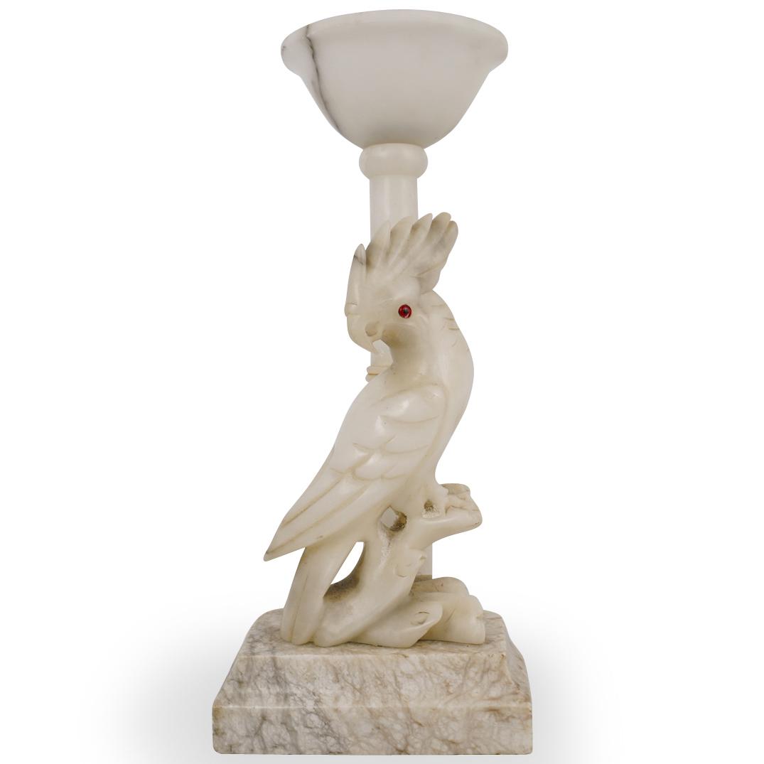 Alabaster Parrot Lamp: DESCRIPTION: An alabaster carved lamp with parrot motif.CIRCA:20th Ct.ORIGIN:ItalyDIMENSIONS: H:16.5" x L:6.75" x W:6"CONDITION: Missing top, and no wiring or outlet connected. condition. See lot desc