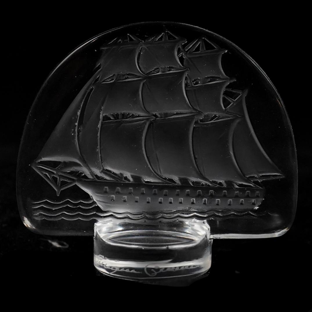 Lalique Crystal "Intaglio" Paperweight: DESCRIPTION: Lalique crystal Intaglio paperweight features ship motifs, marked "Lalique France"CIRCA: 20th Cent.ORIGIN: FranceDIMENSIONS: H: 2.25" W: 2.5"CONDITION: Great condition. See lot descriptio