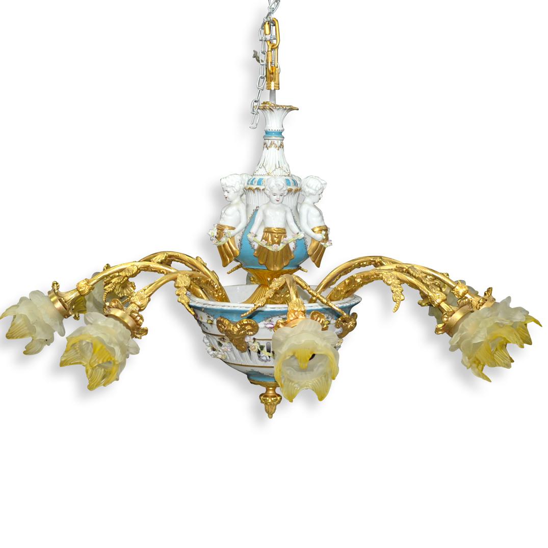 Gilt and Sevres Style Porcelain Figural Chandelier: DESCRIPTION: A French Gilt & Sevres Style porcelain chandelier. Having eight arm wired chandelier featuring double vasiform body in light blue and white porcelain ground with parcel gilt highlights. T