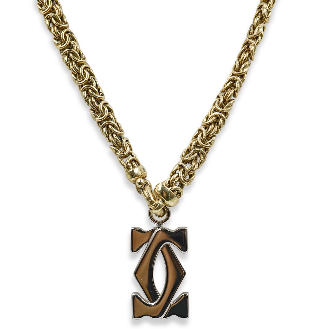 Cartier Sterling Silver Pendant Necklace: DESCRIPTION: A Cartier Pendant marked "Cartier" and composed of silver tones, attached to a gold washed sterling silver necklace marked "925 Italy". Total Weight of Necklace: 35 Grams (Pendant did not