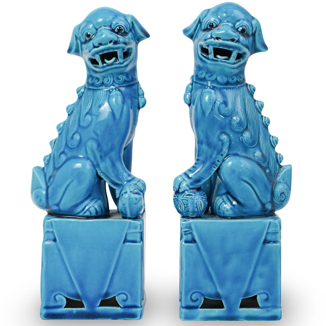 Pair Of Cobalt Blue Foo Dogs: DESCRIPTION: A pair of cobalt blue porcelain foo dogs. CIRCA: 20th Ct. ORIGIN: China DIMENSIONS: H: 10" x W: 2.5" x L: 4" CONDITION: Great condition. See lot description for details on item condition.