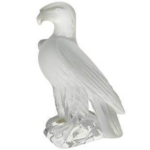 Lalique Crystal "Liberty Eagle": A Lalique crystal "Liberty Eagle" sculpture. Features a frosted crystal eagle standing atop a clear crystal base in a boulder motif. Marked:"Lalique France". CIRCA: 20th-21st Ct. ORIGIN: France