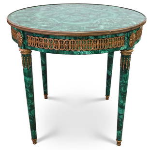 Imperial Malachite and Bronze Table: Malachite Table. A foyer round table featuring a wooden foundation overlaid with malachite design along the legs and base of the table. Fitted With a solid Malachite table top enveloped with dore