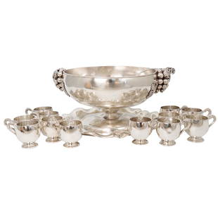 Vintage Sanborns Mexican Sterling Silver Punch Bowl Set: Vintage Sanborns Mexican Sterling Silver Punch Bowl Set. The circular footed bowl is fitted with two grape cluster and leaf form handles. Each cup is flanked by grapevine motif handles. The ladle is f