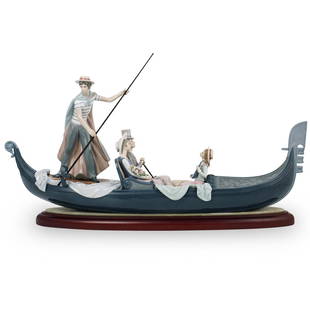 Lladro "In The Gondola" Porcelain Sculpture: A Large Lladro porcelain group titled "In The Gondola" #1350. Sculpted by Vatala and decorated by J. Ruiz. Marked along the underside with artists name and stamped "Lladro Spain". Sits atop a wooden