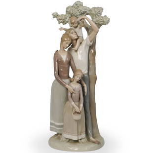 Lladro "La Familia" Porcelain Sculpture: A Large Lladro porcelain group titled "La Familia" number "1201" Designed by "Alfredo Ruiz" features a nuclear family beside a tall tree. Stamped "Lladro Spain" along the underside. CIRCA: 20th Ct.