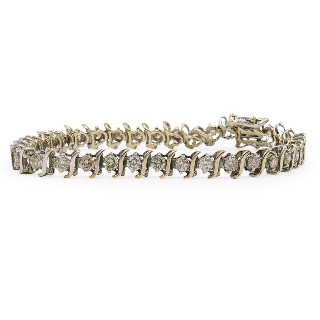 6.5c Carat 14k Gold and Diamond Tennis Bracelet: A tennis bracelet composed of 14k gold, fitted with approx. .2ct single cut diamonds amounting to a total of approx. 6.5 cts. Marked "14k" Total Bracelet Weight: 8.4 dwt (13 Grams) CIRCA: 20th Cent. O