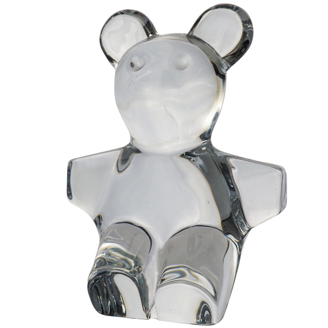 Daum Crystal Teddy Bear: A Daum crystal teddy bear. Stamped on the underside "Daum France" CIRCA: 20th Century ORIGIN: France DIMENSIONS: H. 7.25" x W. 3.5" CONDITION: Great condition. See lot description for details on item 