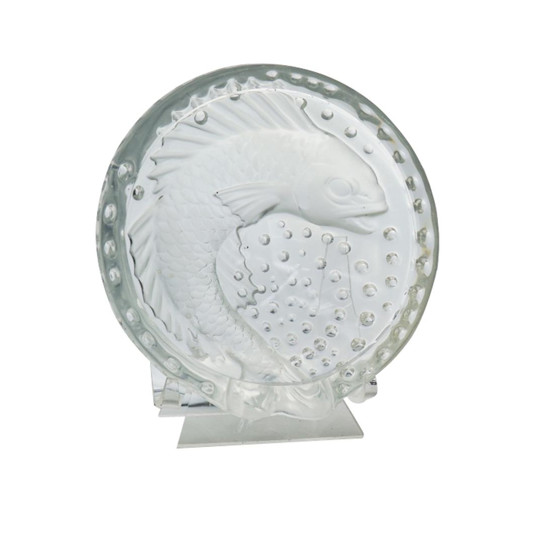 Lalique Crystal "Concarneau" ashtray: Vintage Lalique crystal "Concarneau" ashtray featuring a coy fish and bubbles throughout. Marked Lalique France on the rim. CIRCA: 1970-1980s ORIGIN: France DIMENSIONS: H:2" high and 6.5" in diameter 
