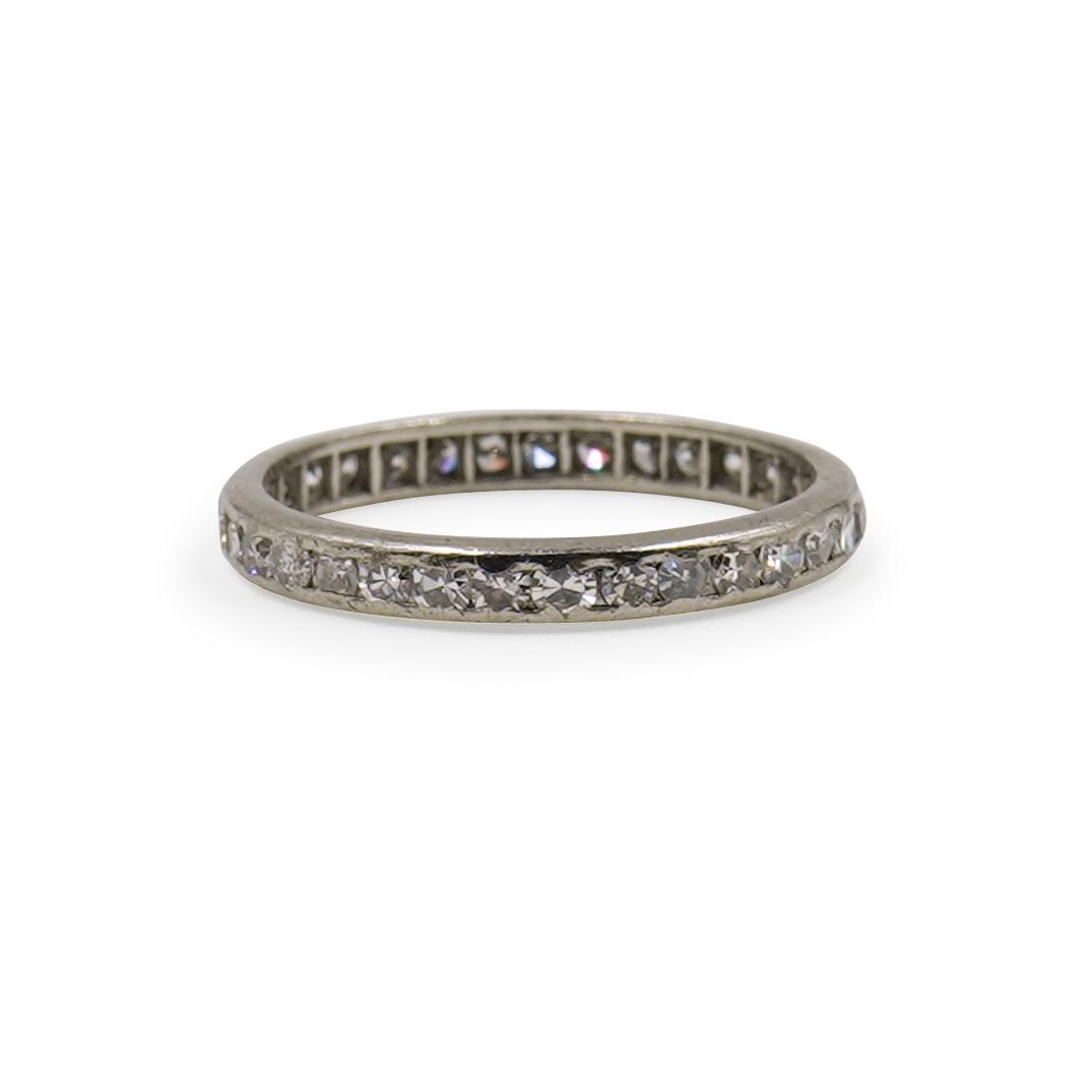 Platinum and Diamond Eternity Ring: An Eternity ring composed of a Platinum foundation, encrusted with diamonds amounting to approx .25 cts Total. Total Weight: 1.1 dwt (1.7 Grams) CIRCA: 20th Cent. ORIGIN: USA DIMENSIONS: Ring Size: 5 