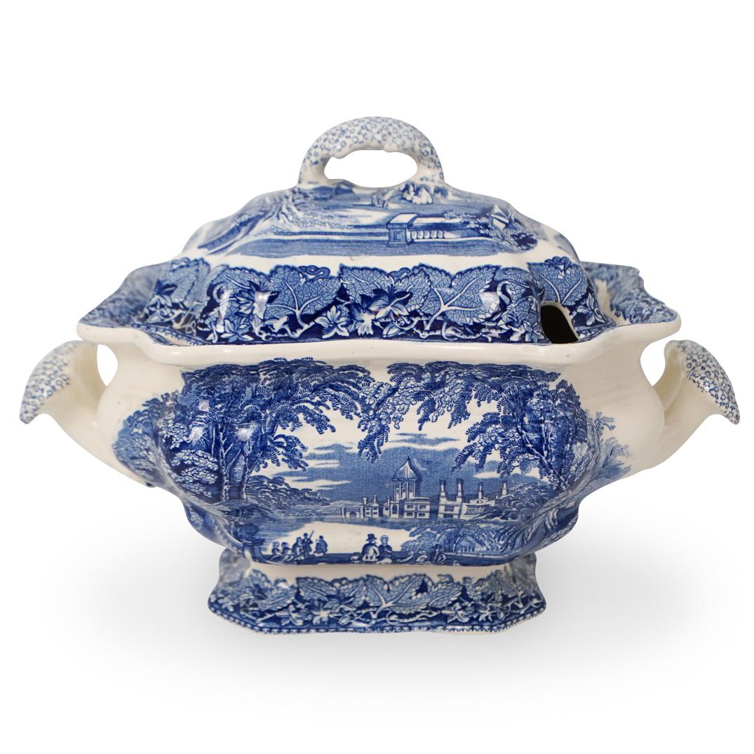 Masons Porcelain Tureen: Masons Porcelain Tureen. Vista Pattern. Features a blue and white design with renderings of figures standing by the riverside. Marked "Masons" underneath. CIRCA: 20th Ct. ORIGIN: England. DIMENSIONS: 
