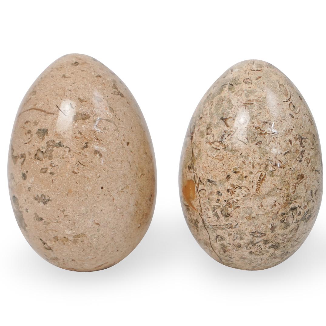 Pair Of Decorative Marble Eggs: A pair of decorative fossil style marble eggs. CIRCA: 20th Ct. ORIGIN: Pakistan DIMENSIONS: H: 6" x D:4" CONDITION: Great condition. See lot description for details on item condition. More detailed co