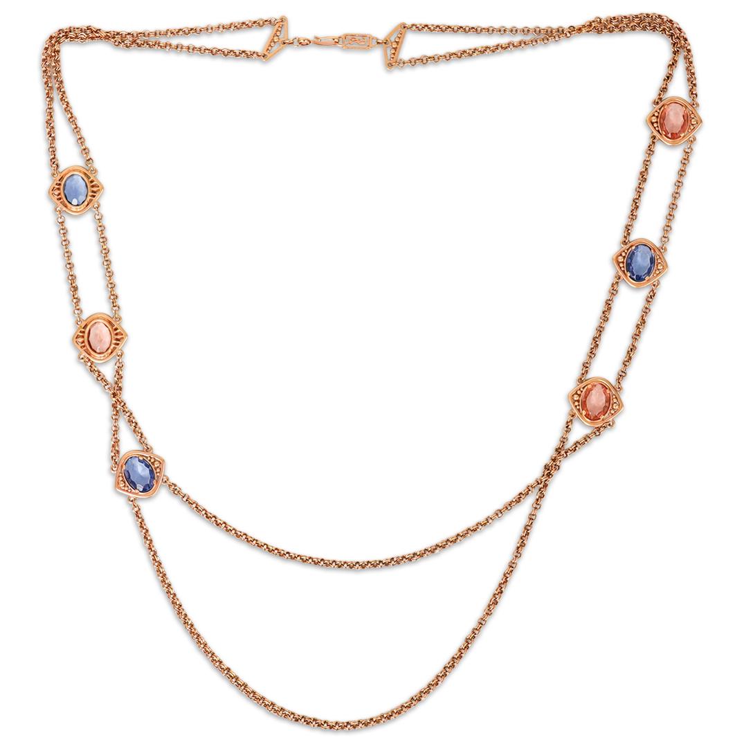 YSL Gold Tone Costume Necklace: YSL gold tone costume necklace with red and blue colored stones. Marked "YSL". CIRCA: 1980s Century ORIGIN: France DIMENSIONS: L 36.0" CONDITION: Great condition. See lot description for details on it
