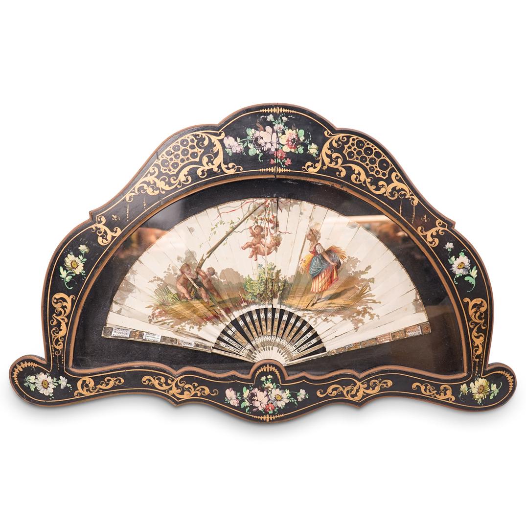 Antique Italian Framed Fan: DESCRIPTION: An antique Italian hand painted fan composed of reticulated bone panels, accented with mother of pearl and gilt details, further embellished with painted figural and cherub scenes. Mounte