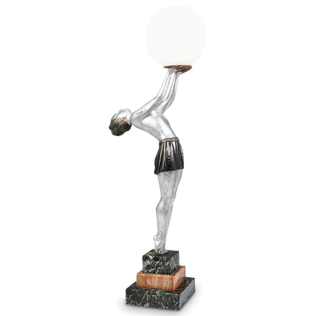 Enrique Molins-Balleste Art Deco Figural Lamp: DESCRIPTION: Enrique Molins-Balleste figural table lamp. Featuring a semi-nude female figure supporting a frosted glass shade. Composed of cold-painted cast-metal in silver and black hues. Sits on a g