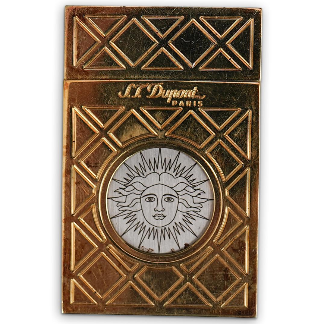St. Dupont Gold Plated Cigar Cutter: DESCRIPTION: St. Dupont gold plated cigar cutter with a woman's face etched onto the blade. Marked "St. Dupont Paris" CIRCA: 20th Century ORIGIN: Paris DIMENSIONS: L 2.0" x W 1.5" CONDITION: Great con