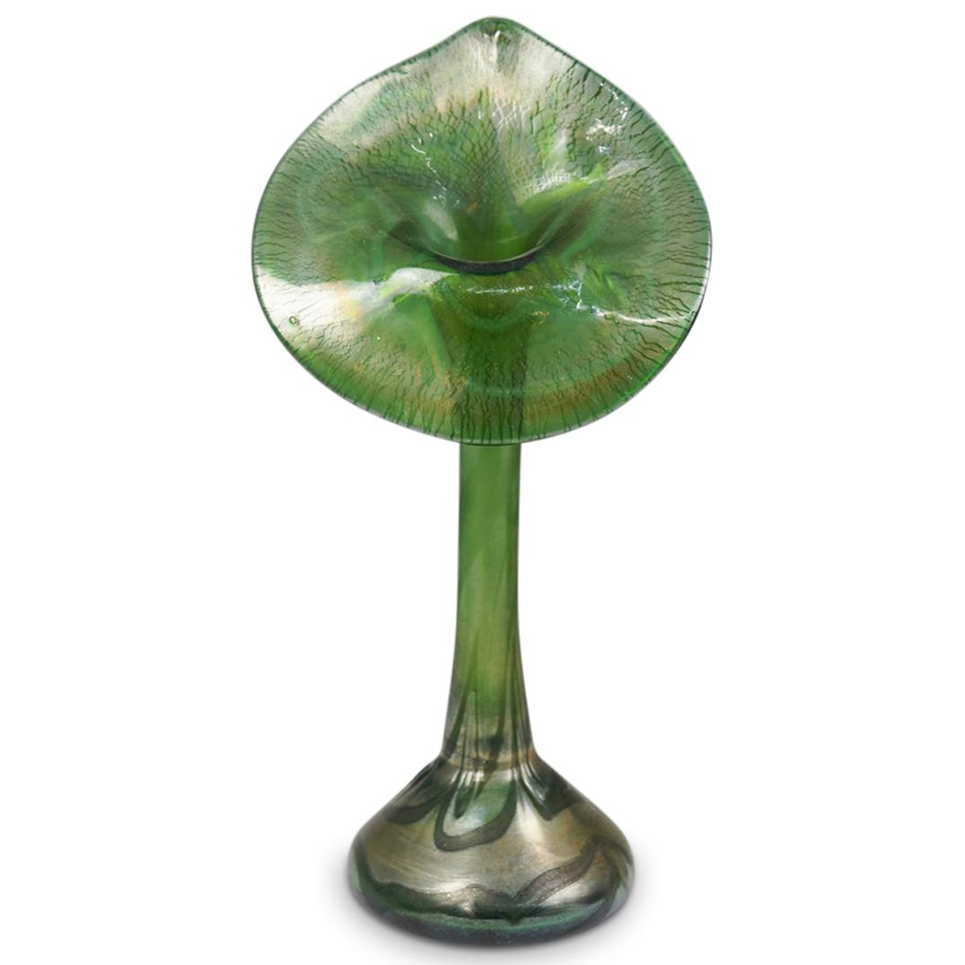 Loetz Style Iridescent Art Glass Pulpit Vase: DESCRIPTION: Art glass vase in a tulip form, decorated in an iridescent green hue. unmarked. CIRCA: 20th Century ORIGIN: Possibly French DIMENSIONS: H 13.5" x 6.0" CONDITION: Great condition. See lot 