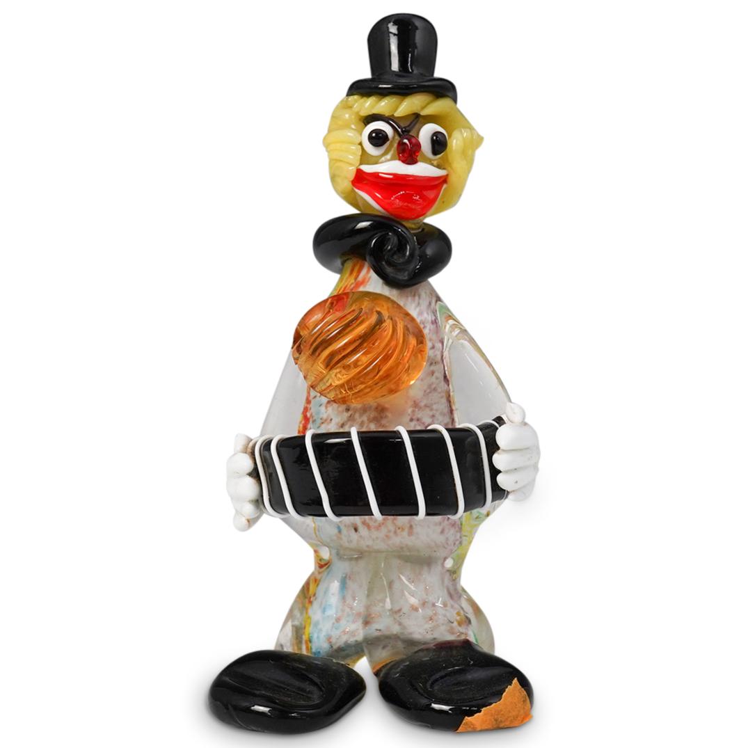 Seguso Signed Murano Glass Clown: DESCRIPTION: Murano glass figurine depicting a clown holding an instrument. The bottom of the clown is signed "Seguso". CIRCA: 20th Century ORIGIN: USA DIMENSIONS: H 7.0" x W 2.0" CONDITION: Great con