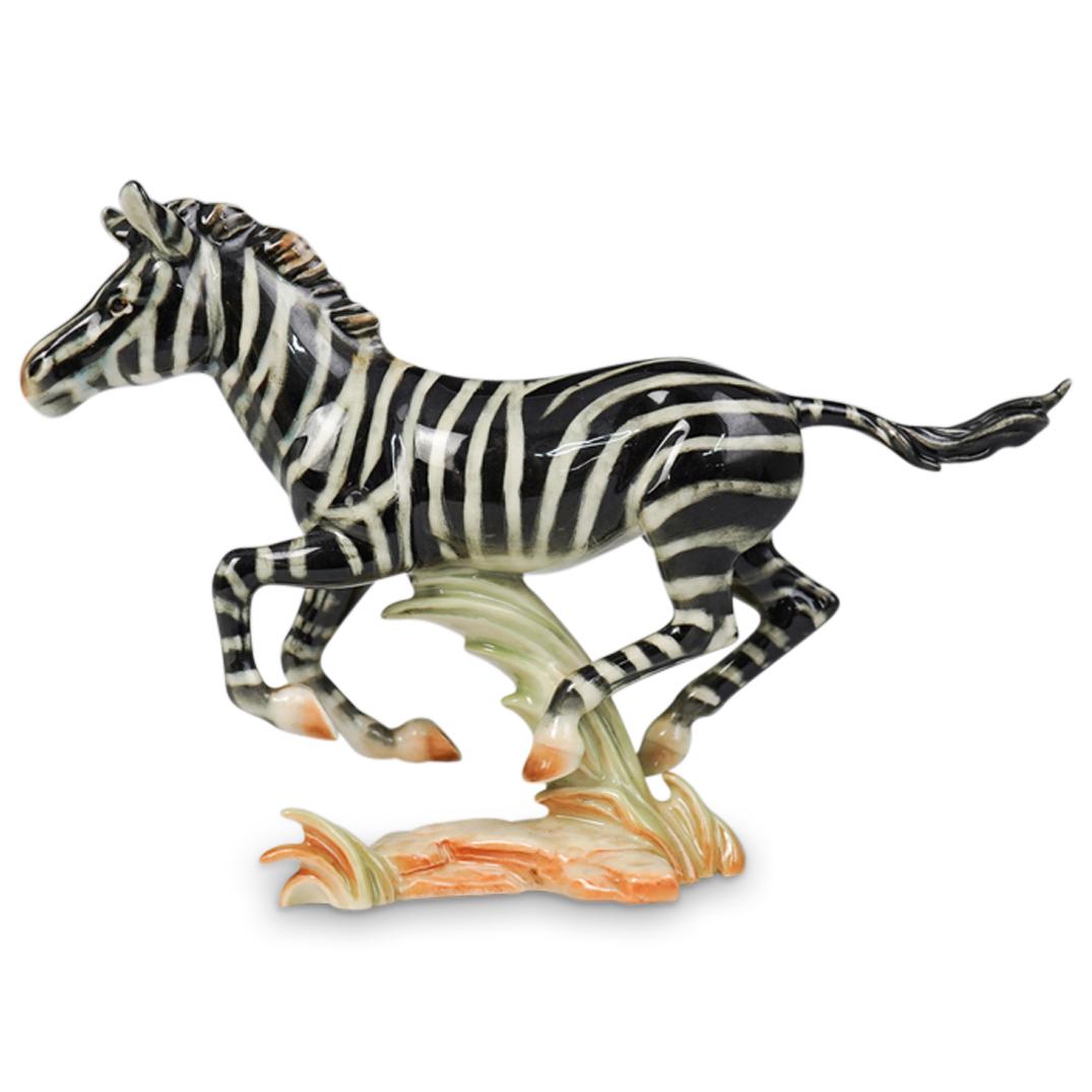 Goebel Zebra-Serengeti Series Figurine: DESCRIPTION: A Goebel zebra-serengeti series figurine. Features a naturalistic zebra composed of glazed and painted porcelain. Bottom marked "Goebel, W Germany" CIRCA: 20th Ct. ORIGIN: Germany DIMENSI