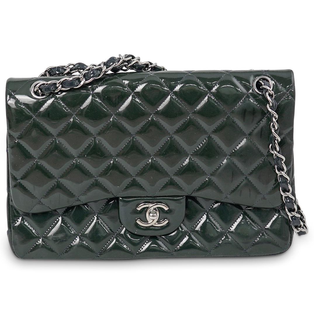 Chanel Double Flap Dark Green Patent Leather Bag: DESCRIPTION: A Chanel patent leather double flap handbag. Features an overall dark green color with silver toned hardware. Interior opens to reveal secondary flap with blue toned leather. Further desi