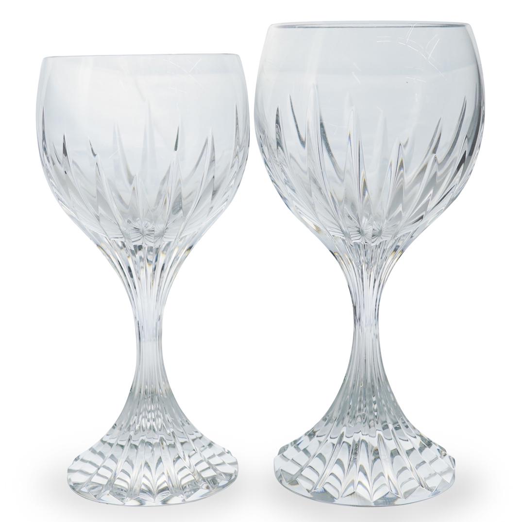 Pair of Baccarat " Jupiter" Wine Glasses: DESCRIPTION: Pair of Baccarat " Jupiter" Wine Glasses. Features adorning beveled cuts going from the base, up the stem, and around the body. " Marked Baccarat" CIRCA:20th ORIGIN: France DIMENSIONS:H:7