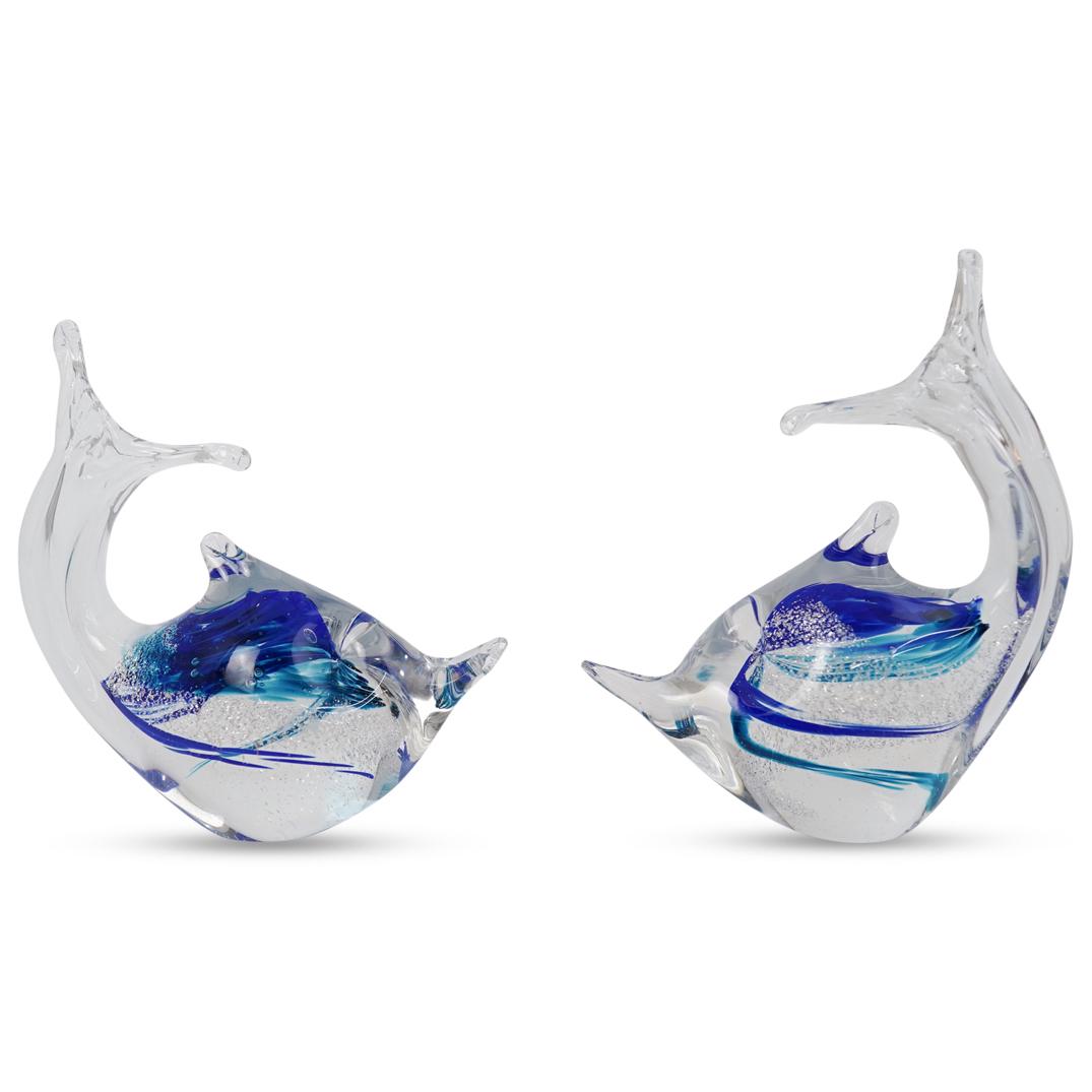 Pair of Murano Glass Dolphins: DESCRIPTION: Pair of Murano glass dolphins featuring blue and turquoise hues infused inside as well as controlled bubble decoration. CIRCA: 20th Century ORIGIN: Italy DIMENSIONS: H 6.5" x W 5.0" CONDI