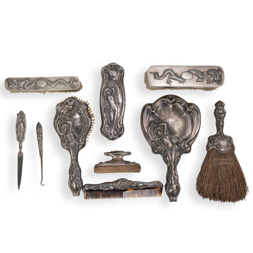 Sterling Silver Vanity Set: DESCRIPTION: (10 Pc) A sterling silver vanity set grouping. Includes: Total Weight: 1278 Grams (1) Art Nouveau figural hand mirror with engraved initial. Marked "Sterling" (H:10" x L: 6") (1) Art Nouv