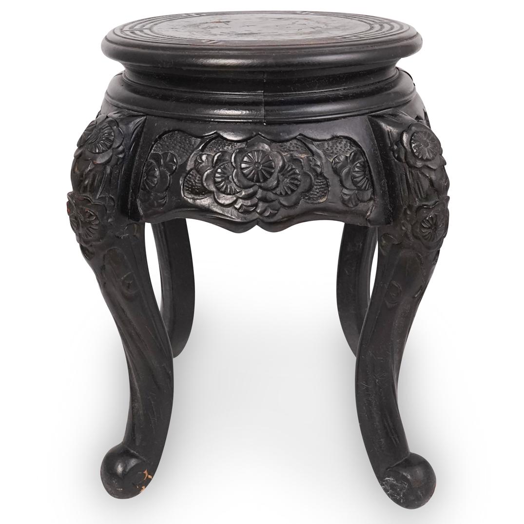 Japanese Carved Lacquered Wood Stool: DESCRIPTION: A Japanese Lacquered wood stool features hand carved floral patterns along the skirt and legs. Marked "Made In Japan" at bottom. CIRCA: Mid 20th Cent. ORIGIN: Japan DIMENSIONS: H: 16" W: 