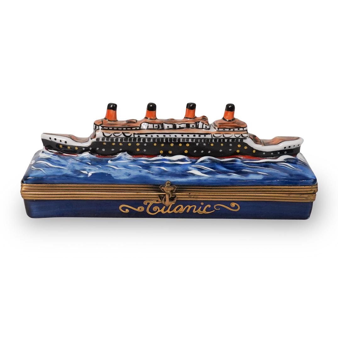 Limoges Porcelain Titanic Pill Box: DESCRIPTION: A Limoges porcelain pill box featuring the Titanic in waters hand painted. Finished with a gilt metal hardware lining the hinge. Marked inside " TITANIC LIVERPOOL" Marked along the unders
