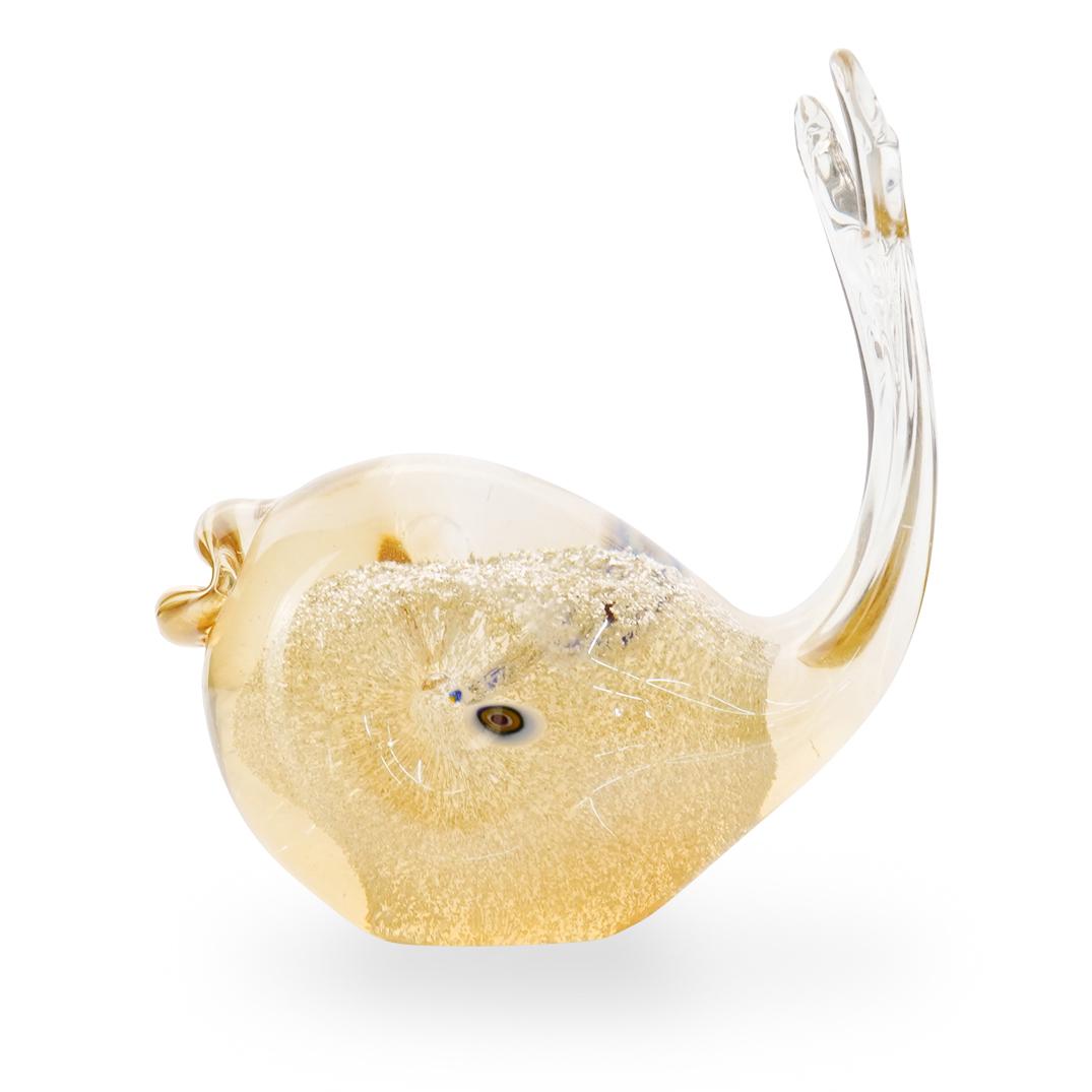 Murano Glass Fish Figurine: DESCRIPTION: Murano glass figurine depicting a fish, featured in a gold hue with controlled bubbles infused, and millefiori accent. CIRCA: 20th Century ORIGIN: Italy DIMENSIONS: H 4.5" x W 4.0" CONDIT