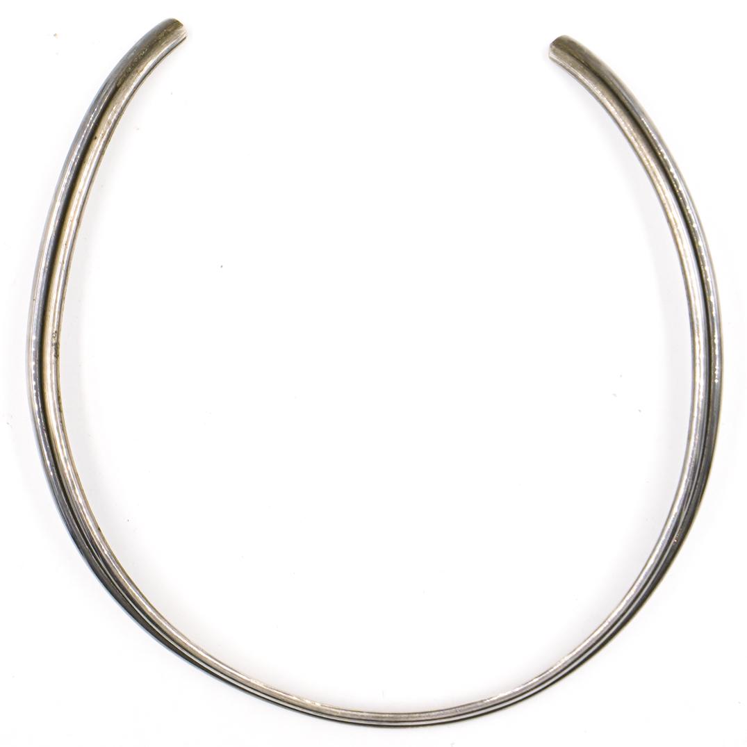 Sterling Silver Choker: DESCRIPTION: A sterling silver choker necklace. Marked "Sterling, M" Total Weight: 40 Grams CIRCA: 20th Ct. ORIGIN: USA DIMENSIONS: D: 5" Total Weight: 40 Grams CONDITION: Great condition. See lot des