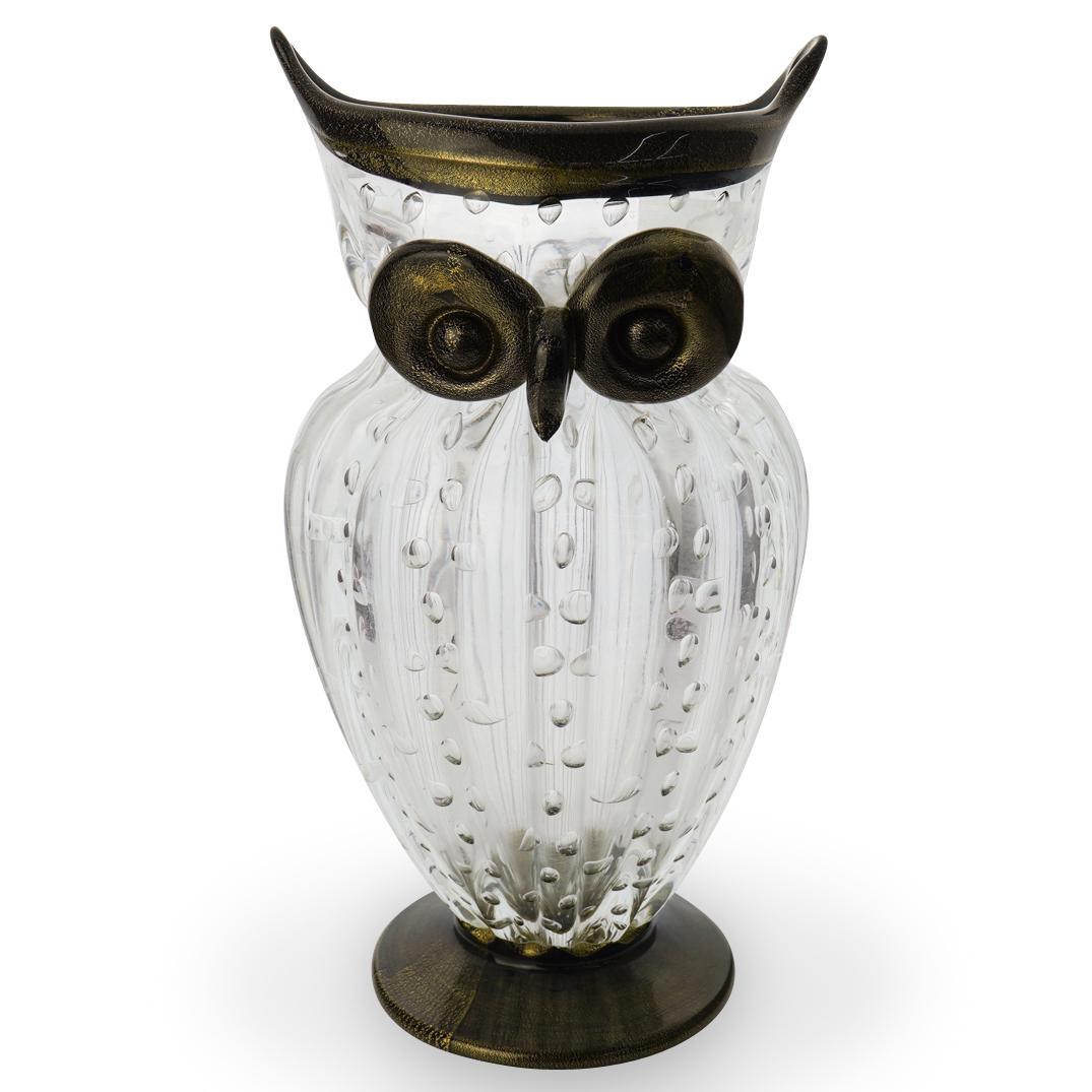 Gambaro & Poggi Murano Owl Vase: DESCRIPTION: A murano glass vase in the shape of an owl designed by Gambaro And Poggi featuring a clear glass modernist body with bubbles finished with black and gold eyes to match the base and top. W