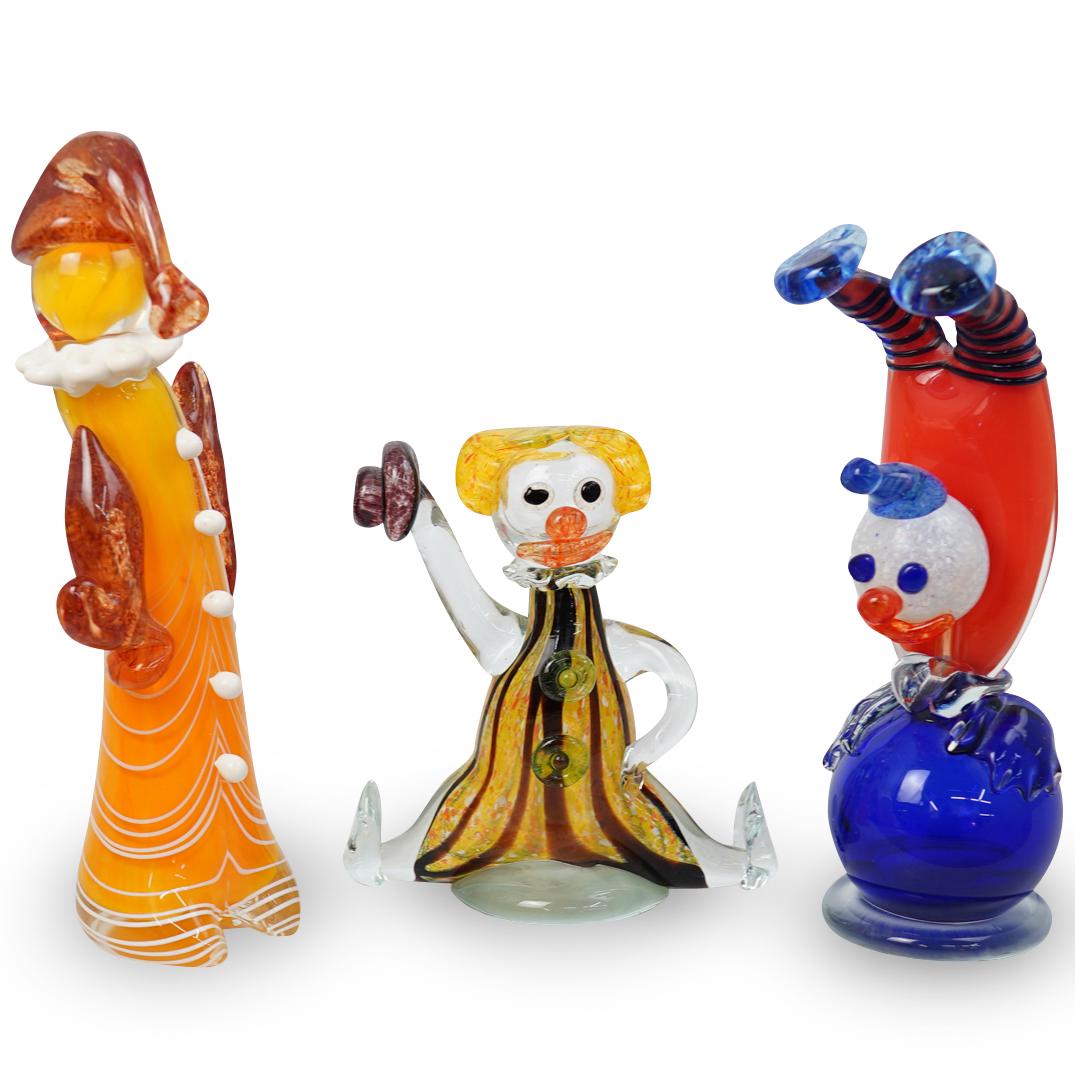 3 Murano Hand Blown Glass Clowns: DESCRIPTION: A lot of 3 Murano hand blown glass clowns in multi color motifs. CIRCA: 1970-1990s ORIGIN: Italy DIMENSIONS: Approx: 11.5" by 3.5" CONDITION: Great condition. See lot description for deta