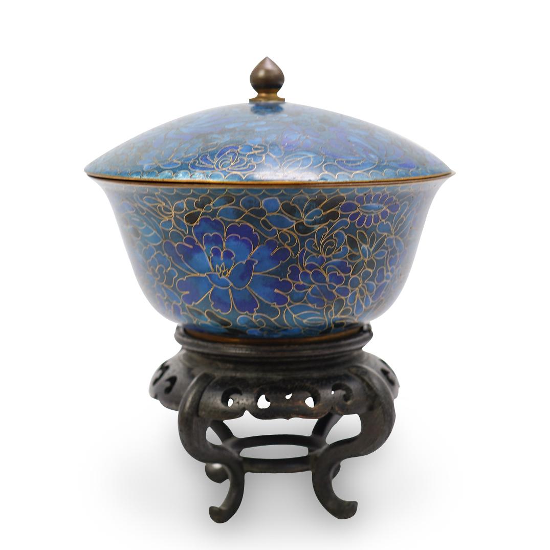 Chinese Antique Cloisonne Lidded Bowl: DESCRIPTION: A Chinese cloisonne lidded bowl in vibrant ground blue color tones. Features a floral motif design with globular form, rising to a domed lid topped with a pointed tipped sphere finial. Di