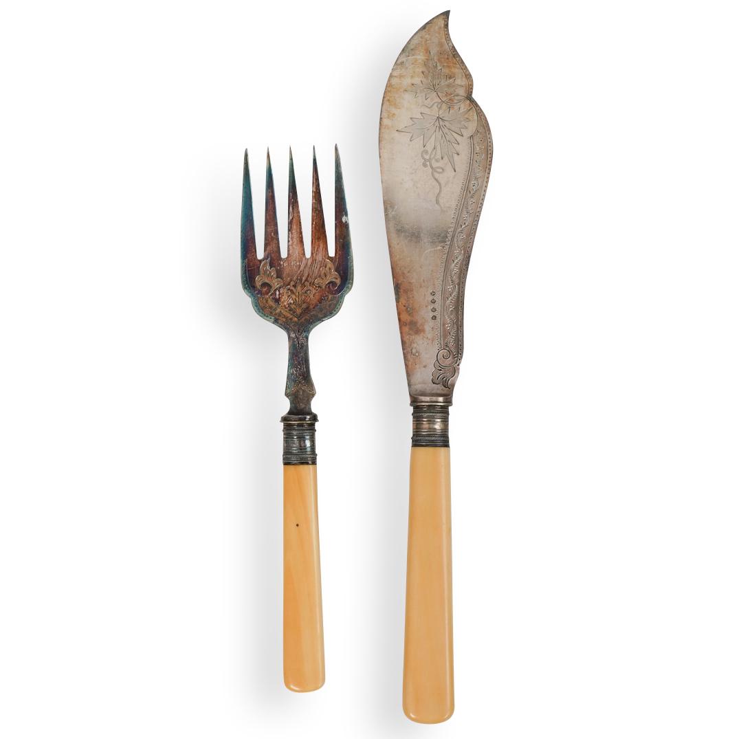 English Silver Plated Fish Serving Set: DESCRIPTION: English Silver Plated Fish Serving Set. Finished with floral patterns and bone handles. CIRCA: 20th Century ORIGIN: England DIMENSIONS:H:12.25" (Knife) H:9.5" (Fork) CONDITION: Great cond