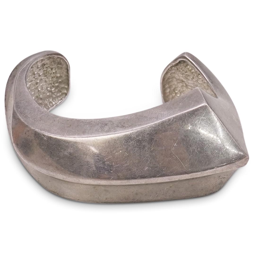 Modernist Sterling Silver Cuff: DESCRIPTION: A Modernist sterling silver cuff features in a modernist design with concave pattern along the front body. Total Weight: 59 Grams CIRCA: 20th Cent. ORIGIN: Continental DIMENSIONS: Cuff DI