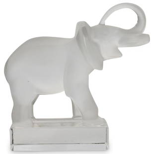 Lalique "Elephant" Paperweight: DESCRIPTION: Lalique footed frosted crystal "Elephant" paperweight sculpture, elephant is smiling with it's trunks up. Signed "Lalique France" on bottom of the base. CIRCA:20th Century ORIGIN: France