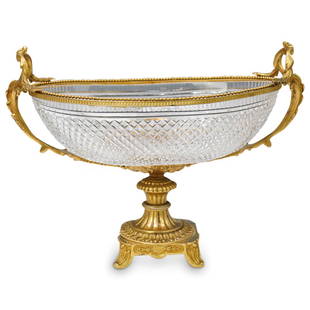 French Gilded & Cut Crystal Centerpiece: DESCRIPTION: Antique footed hand diamond cut crystal and gilt bronze mounted centerpiece, attributed to Baccarat. Finely cast and hand chased gilt bronze is modeled into curving floral leaf handles. O