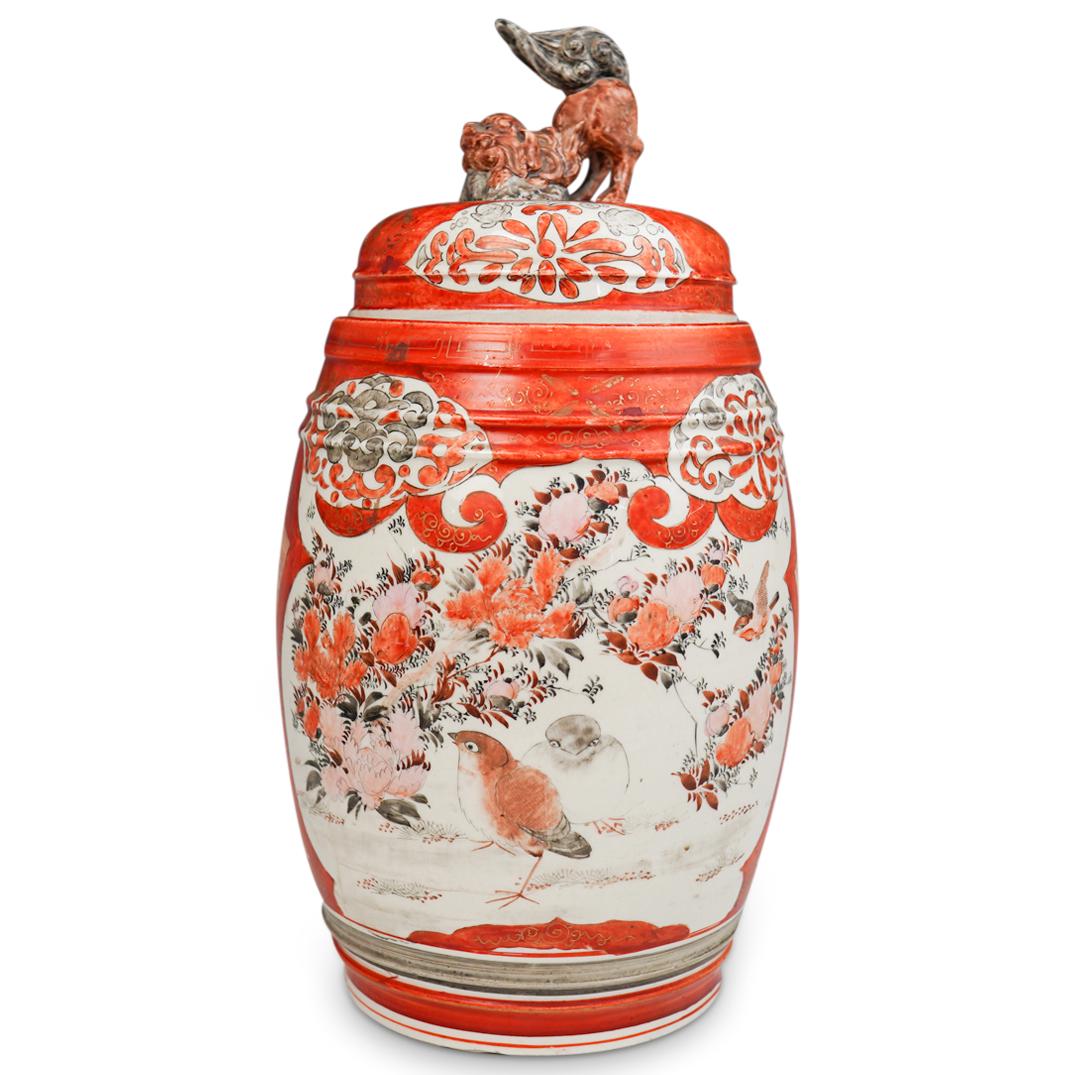 Antique Japanese Kutani Porcelain Urn: DESCRIPTION: An antique Japanese Kutani porcelain urn. Features painted birds and floral decorations throughout body. Further decorated with figural scenes and scrolling details. Finished with a food 