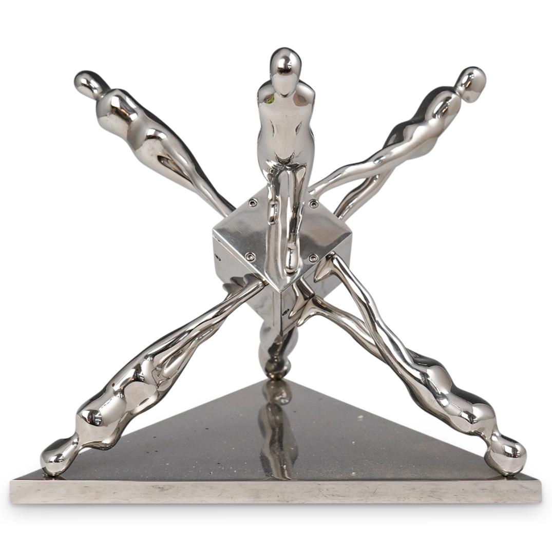 Ernest Trova "Walking Jackman" Chromed Steel Sculpture: DESCRIPTION: A sculpture by surrealist artist Ernest Trova composed of Chromed steel titled "Walking Jackman". Marked along the bottom Edition "78 of 99" and dated 1986 with Trova stamp. Comes with ar