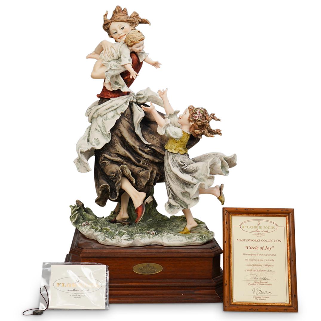 Giuseppe Armani "Circle of Joy" Porcelain Sculpture: DESCRIPTION: Giuseppe Armani "Circle of Joy" Porcelain Sculpture. Depicts young woman in peasant costume walking and holding rambunctious baby over her shoulder while being trailed by girl child with