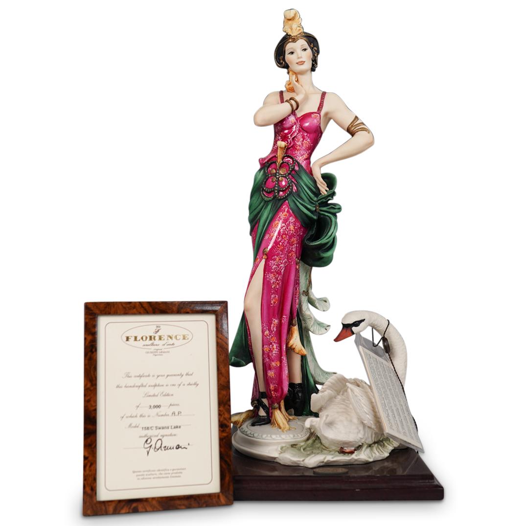 Giuseppe Armani "Swans Lake 158/C" Porcelain Sculpture: DESCRIPTION: Giuseppe Armani "Swans Lake 158/C" Porcelain Sculpture. Depicts depicting a regal Art Deco dressed woman standing next to a swan. Limited Edition "AP" Artist Proof of 3000. Sits on square