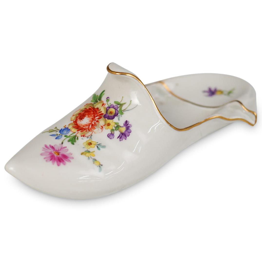 Meissen Porcelain Shoe: DESCRIPTION: Meissen Porcelain Shoe features hand painted floral decoration. Traditionally marked on the bottom. CIRCA: 20th Century ORIGIN: Germany DIMENSIONS:L:7" W:2.25" CONDITION: Good condition. 