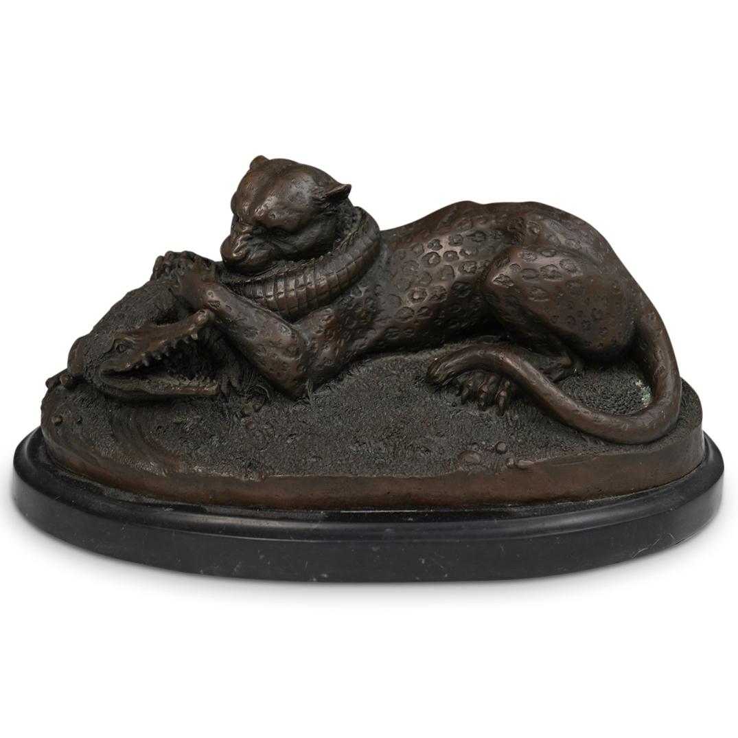 After Antoine-Louis Barye (France 1795-1875): DESCRIPTION: After Antoine-Louis Barye (France 1795-1875) depicts a black panther biting an alligator. Finished with a black oval marble base. CIRCA: 20th Century ORIGIN: France DIMENSIONS:H:8" W:15" 